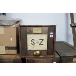 An Early 1900's Pine Factory Shop Filing Cabinet, with original labels and brass cup handle, (