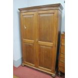 Early XX Century Oak Cupboard, with stepped cornice, panelled doors, bun feet, later inner