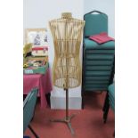 A Victorian/Edwardian Bentwood Wicker Shop Mannequin, on a metal stand, approximately 145cm high.