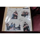 The Beatles 1960's English Made Wallpaper Section, featuring images and facsimile signatures of