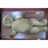 Teddy Bear, circa mid XX Century, gold plush with growler, black stitch mouth, plastic nose and