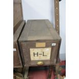 An Early 1900's Pine Factory Shop Filing Cabinet, with original labels and brass cup handle, (