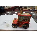 Tin Plate KO of Japan Clockwork Powered Circus, vehicle in red, 12cm long.