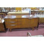 1970's Sideboard, in the G Plan Manner, having lipped handles to three left drawers and twin