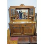 Early XX Century Oak Mirror Backed Sideboard in the Arts & Crafts manner, with shell motif to