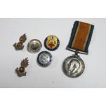 A WWI War Medal to 123315 Gnr H.C. Gundill, RA, plus two RA badges, among other items.