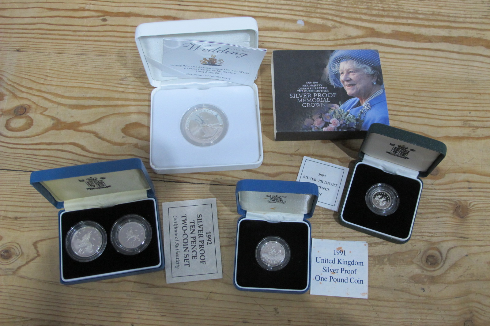 Four Royal Mint Silver Proof Coins, a William and Kate Wedding 2011 Silver Crown, a 1991 One