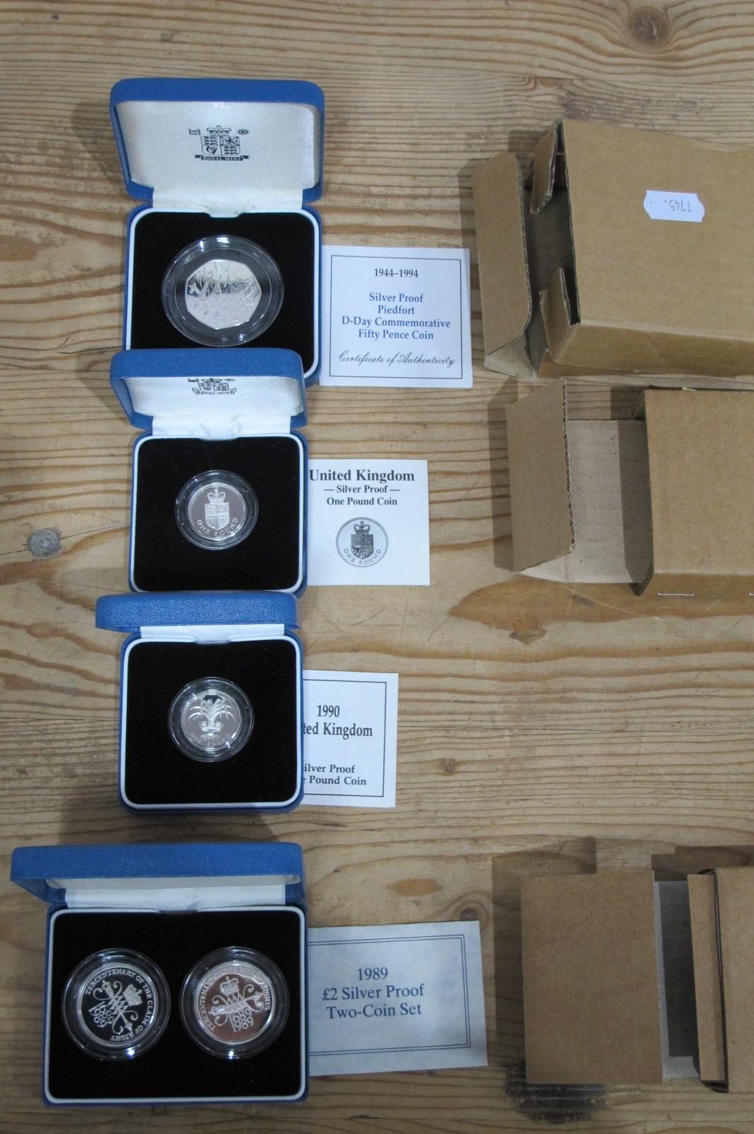 Four Royal Mint Silver Proof Coins, 1988? One Pound, 1990 One Pound, 1994 D-Day Fifty Pence, 1989