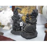 Two Cast Iron Punch Door Stops, the highest 31cm.