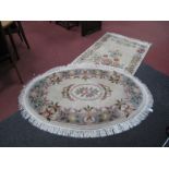 Chinese Tassled Rug, with 'X' and floral decoration on cream ground, 180 x 92cm; another oval. (2)