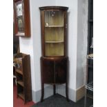 Mahogany Cylinder Fronted Double Height Corner Cupboard, with brass mounts, glazed upper door over