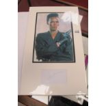 Grace Jones Autograph, blue ink signed, as a montage with images of her holding pistol, unverified.