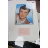 Rock Hudson Autograph, blue ink signed, as a montage with coloured images of him, unverified.