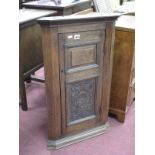 Early XX Century Oak Corner Wall Cupboard, with carved lower panel to single door, 80.5cm high.
