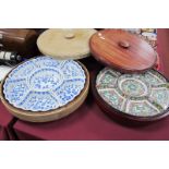 A Chinese Style Wooden Lazy Susan, with famille verte pottery sectional dishes; plus another with