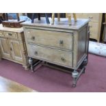 Oak Chest of Two Drawers, circa 1920's, on cup and cover and block supports, 91.5cm wide.
