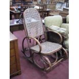 A Mid 1900's Bentwood Rocking Chair, the seat and back in original bergeres.