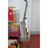 Lumex Telescope on Tripod, Lacrosse and Hockey sticks.