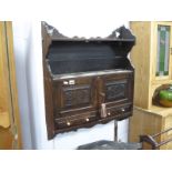 Late XIX Century Oak Wall Rack, having single shelf over carved doors 'AFB 1899' and twin doors,