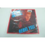 Billy Idol Autograph, black pen signed on the cover of Rebel Yell with single, unverified.