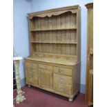 XIX Century Pine Dresser, with glass handles to seven drawers, cupboard door, on turned legs,
