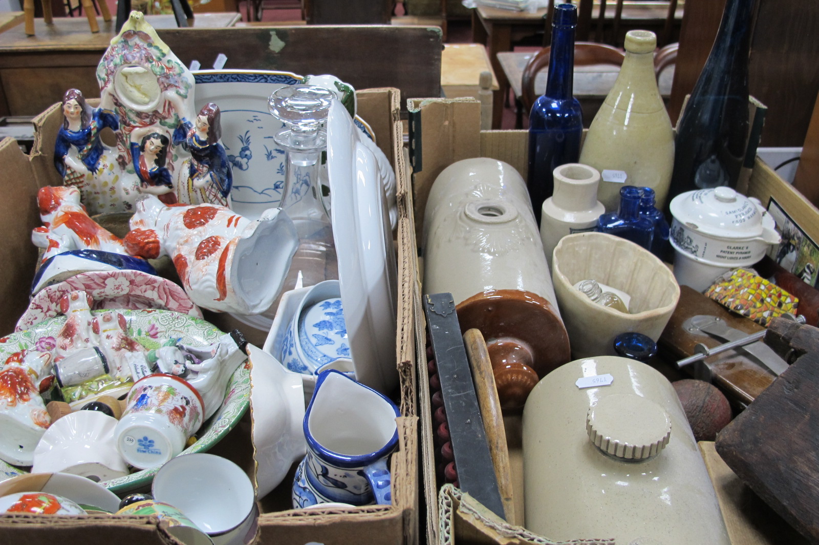 Decanter, stoneware bottle, foot warmers, tie press, Staffordshire spaniels, etc:- Two Boxes