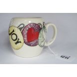 A Moorcroft Pottery Mug, painted in the 'Joy' design by Kerry Goodwin, 9cm high.