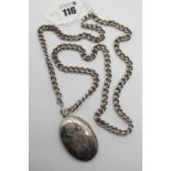 A Large Oval Locket Pendant, allover leaf scroll engraved, stamped inside "Sterling 925" (length