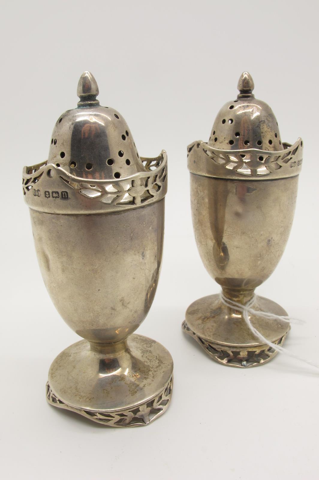 A Pair of Hallmarked Silver Pepperettes, Deakin & Francis, Birmingham 1912, each raised on