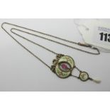 An Early XX Century Gilt and Enamel Pendant, oval collet set to the centre, highlighted in pink