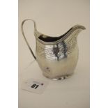 A Hallmarked Silver Jug, (makers mark rubbed) possibly London 1799, foliate engraved with prick