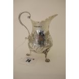 A Hallmarked Silver Cream Jug, Charles Boyton, London 1875, of baluster form with engraved foliate