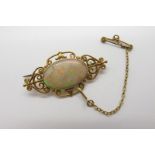 A c.Early XX Century Opal Set Brooch, oval collet set to the centre with a (19mm wide) single