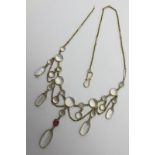 An Edwardian Moonstone Festoon Style Necklace, oval and circular spectacle set, with hanging