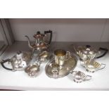 A Plated Four Piece Tea Set, of oval semi reeded form, together with a plated three piece tea set,