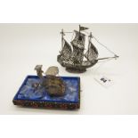 A Miniature Filigree Model of A Galleon, at full sail, on oval filigree base, overall height 11.5cm;