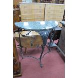 A Demi Lune Hall Table, with marble top, iron base having tassle drops, 77cm wide.