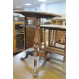 XIX Century Mahogany Pedestal Table, with snap action to oval top, turned support, on tripod legs.