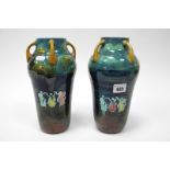 A Pair of Wardle Pottery Vases, of tapered cylindrical form, each with four lug handles to the