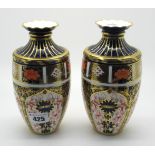 A Pair of Royal Crown Derby Porcelain Vases, of ovoid form with fluted necks and wavy rims,