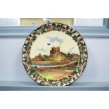 A Royal Doulton Early XX Century Pottery Charger, of circular form, decorated with a castle and