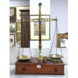 Late XIX Century Brass Weighing Scales with Weights, mounted on a wooden base with single drawer,