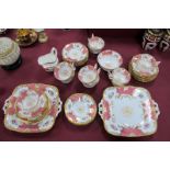 A Coalport Porcelain Tea Service, decorated in the Batwing pattern with panels of floral sprays