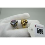 A Large Modern Single Stone Dress Ring, oval four claw set high between inset shoulders, (finger
