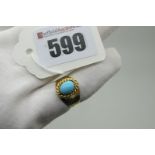 A Middle Eastern Single Stone Dress Ring, oval cabochon set, between high tapering textured