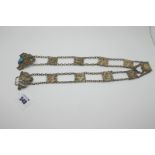 A Vintage Ladies Belt, of Egyptian design, composed of nine square decorative panels, on chain