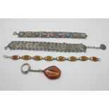 A Small Collection of Panel Style Bracelets, including a coin style souvenir bracelet, depicting