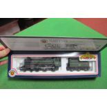A 'OO' Scale Bachmann No 31-101, 4-6-0 standard 4MT locomotive and tender, in BR green, boxed.