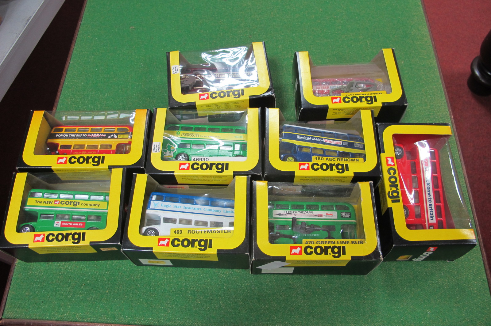 Nine 1980's Corgi Routemasters, all boxed including 'Pop on This Bus to HMV Shop'.