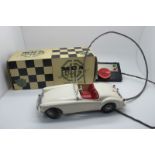 A Victory Industries Remote Control MGA, finished in white, appears complete but windscreen damaged,